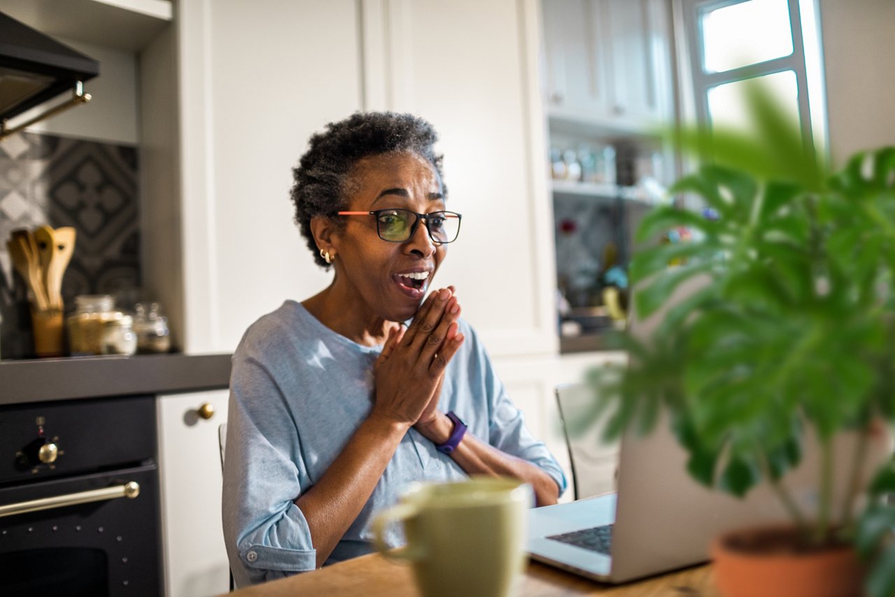 Close up of a senior woman using a laptop